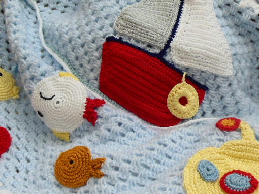 crochet-baby-blanket-with-sailboat-and-sealife-design