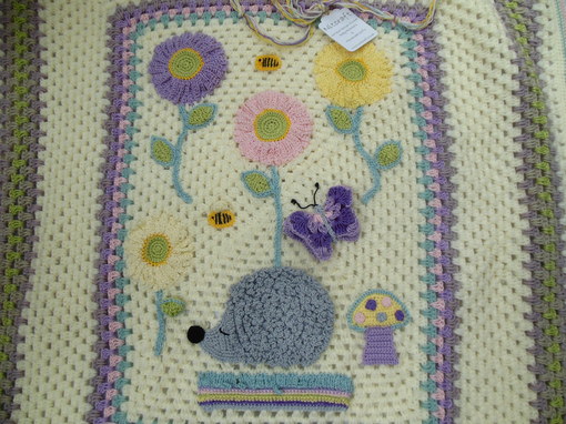 handmade-baby-blanket-with-hedgehog-flowers-and-bee-design